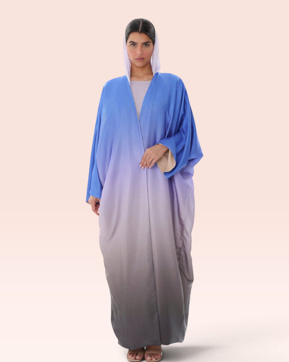 Amore Abaya Boutique Sunset Ombre Bisht Abaya in blue to grey gradient, featuring a lightweight, flowy silhouette.