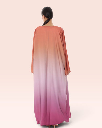 Amore Abaya Boutique Sunset Ombre Bisht Abaya featuring a flowy, lightweight design in orange to pink gradient.
