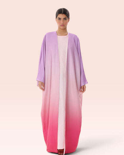 Amore Abaya Boutique Sunset Ombre Bisht Abaya in light purple to vibrant pink gradient, lightweight flowy fabric