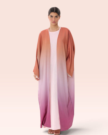 Amore Abaya Boutique Sunset Ombre Bisht Abaya featuring a lightweight flowy design in gradient orange and pink tones.