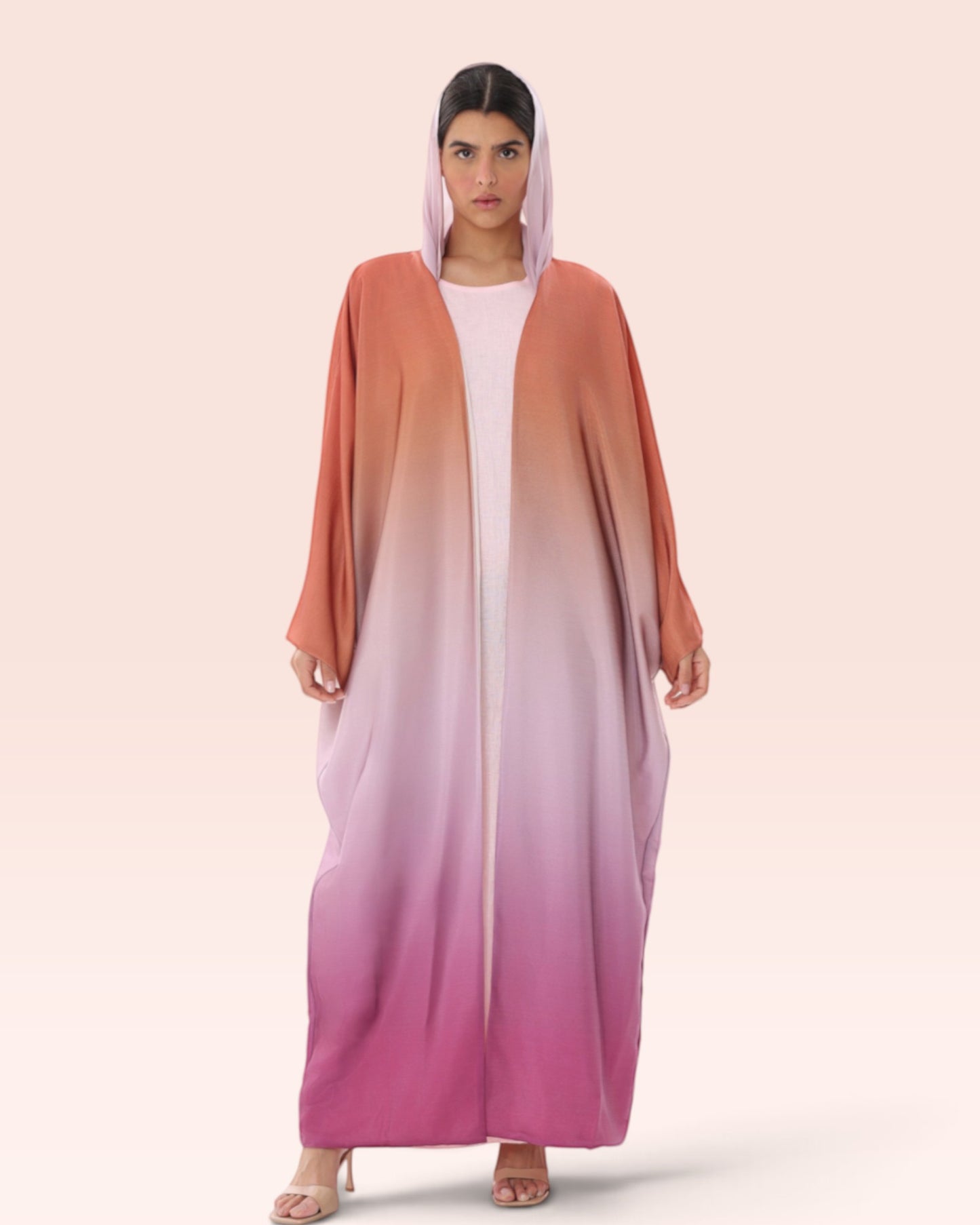 Amore Abaya Boutique Sunset Ombre Bisht Abaya in a lightweight, flowy fabric with a gradient orange to pink design.